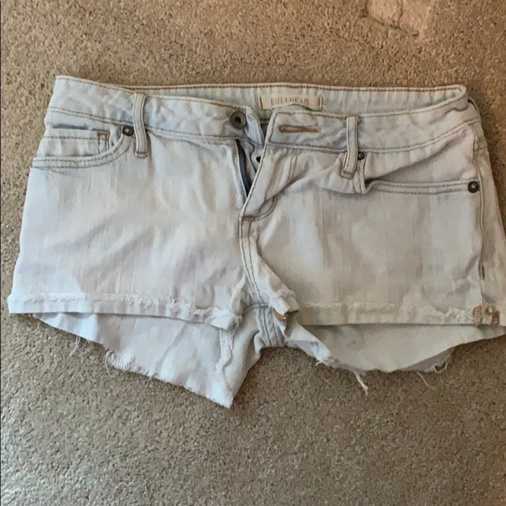 Light washed distressed jean short shorts